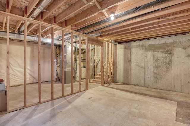 6919 N Pine Rock Pl, Spokane, WA 99208 - unfinished basement with heating unit and stairway