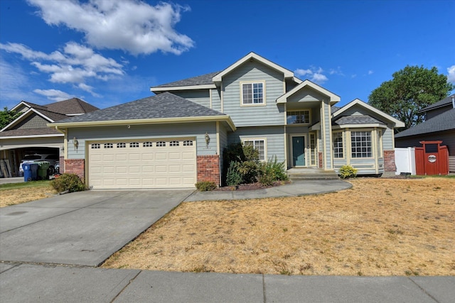 6919 N Pine Rock Pl, Spokane, WA 99208 - view of front of home with brick siding, an attached garage, and concrete driveway