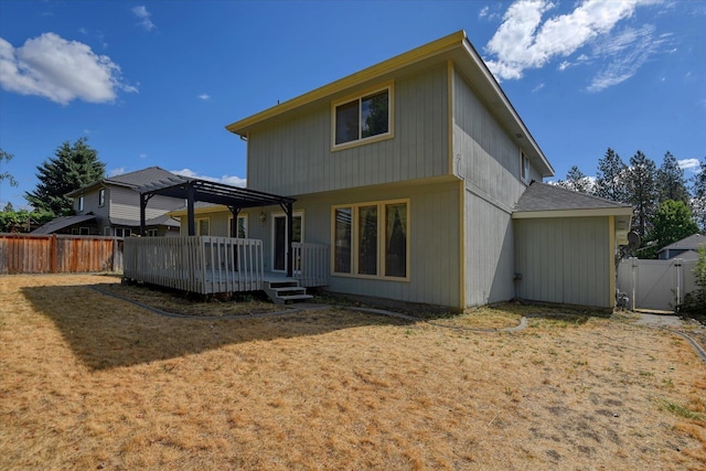 6919 N Pine Rock Pl, Spokane, WA 99208 - rear view of house with a deck, a fenced backyard, a pergola, and a gate