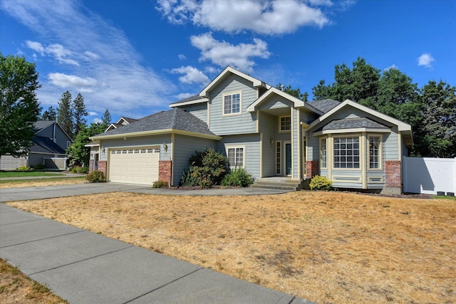 6919 N Pine Rock Pl, Spokane, WA 99208 - view of front of house with brick siding, concrete driveway, and an attached garage