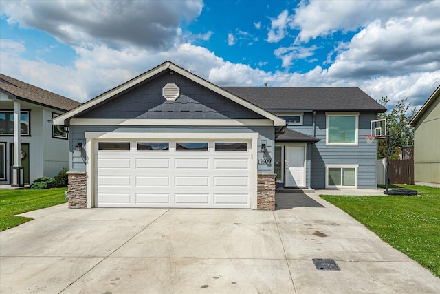 17609 E 2nd Ln, Spokane Valley, WA 99016 - view of front of property with stone siding, driveway, a front lawn, and an attached garage