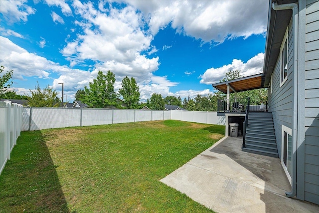 17609 E 2nd Ln, Spokane Valley, WA 99016 - fenced backyard featuring stairs and a patio area