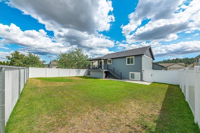 17609 E 2nd Ln, Spokane Valley, WA 99016 - back of house with stairway, a fenced backyard, and a gate