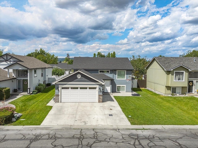 17609 E 2nd Ln, Spokane Valley, WA 99016 - view of front of home featuring concrete driveway, a front lawn, stone siding, and a residential view