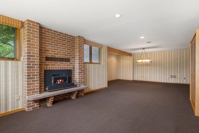 6624 S Ben Burr Rd, Spokane, WA 99223 - unfurnished living room featuring carpet, a brick fireplace, wallpapered walls, and recessed lighting