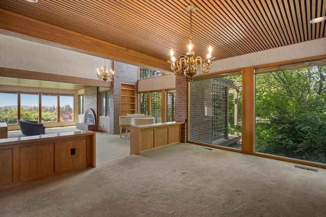 6624 S Ben Burr Rd, Spokane, WA 99223 - kitchen featuring a chandelier, open floor plan, light colored carpet, plenty of natural light, and wood ceiling