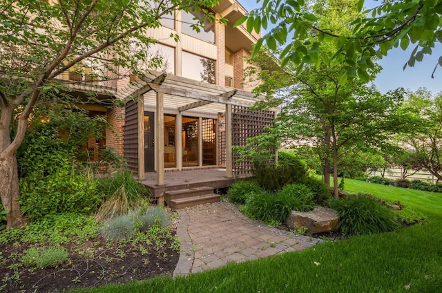 6624 S Ben Burr Rd, Spokane, WA 99223 - back of property featuring a pergola, brick siding, a deck, and a lawn