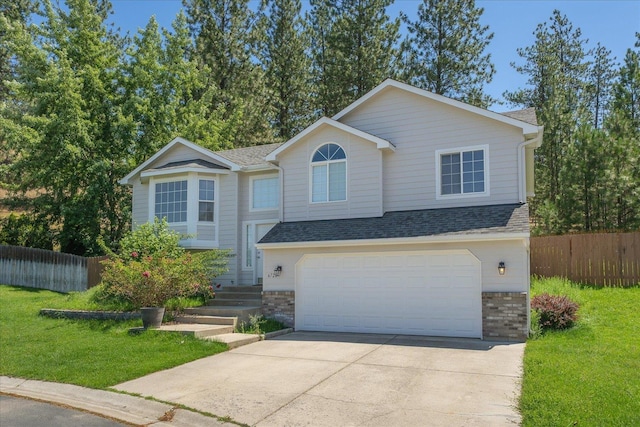 6720 N Royal Ln, Spokane, WA 99208 - view of front facade with concrete driveway, an attached garage, and a shingled roof