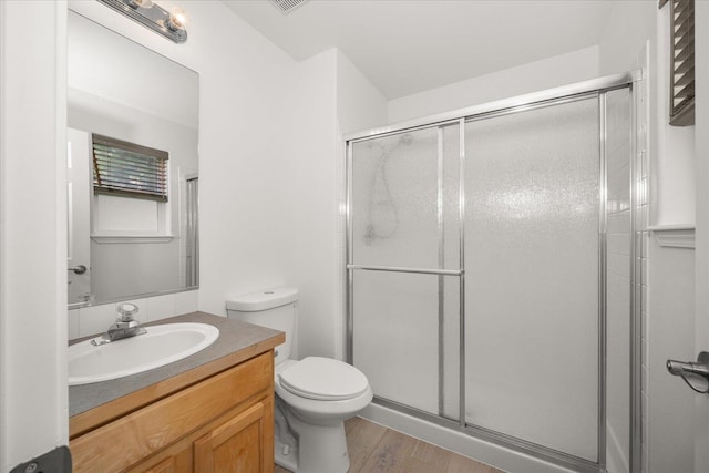 6720 N Royal Ln, Spokane, WA 99208 - bathroom with a stall shower, vanity, and wood finished floors