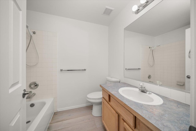 6720 N Royal Ln, Spokane, WA 99208 - bathroom with bathing tub / shower combination, vanity, and wood finished floors