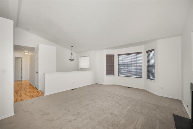 6720 N Royal Ln, Spokane, WA 99208 - carpeted spare room featuring lofted ceiling and baseboards