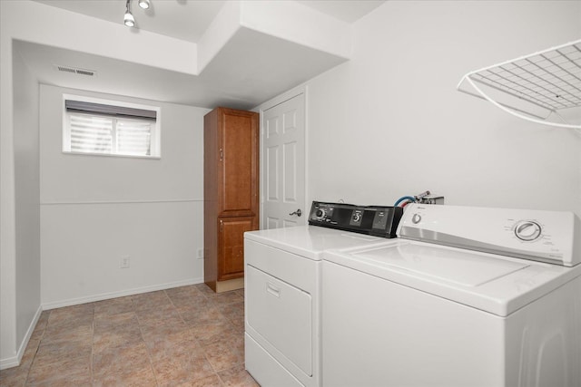 6720 N Royal Ln, Spokane, WA 99208 - laundry area with washer and dryer and cabinet space