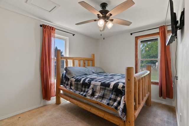 2815 N Bowman Rd, Spokane Valley, WA 99212 - bedroom with light colored carpet, multiple windows, attic access, and ceiling fan