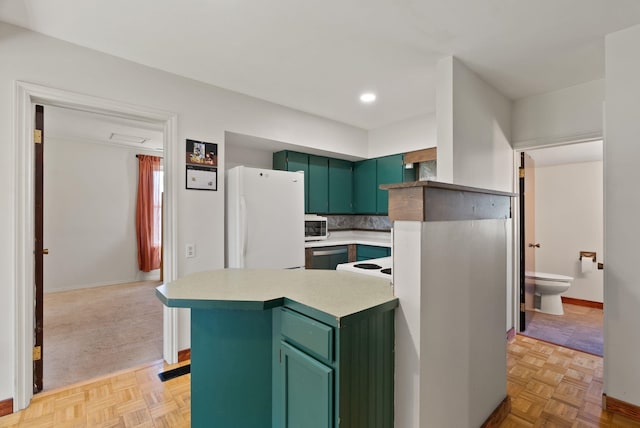 2815 N Bowman Rd, Spokane Valley, WA 99212 - kitchen featuring green cabinetry, white appliances, light countertops, decorative backsplash, and recessed lighting
