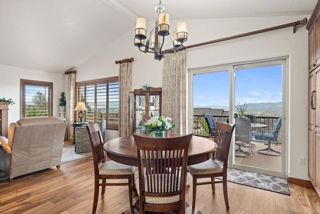 8918 E Clearview Ln, Spokane, WA 99217 - dining room featuring a chandelier, light wood-style flooring, and high vaulted ceiling