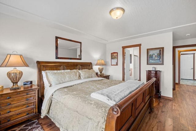 8918 E Clearview Ln, Spokane, WA 99217 - bedroom featuring wood finished floors and connected bathroom