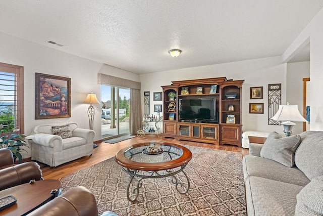 8918 E Clearview Ln, Spokane, WA 99217 - living room with wood finished floors and a textured ceiling