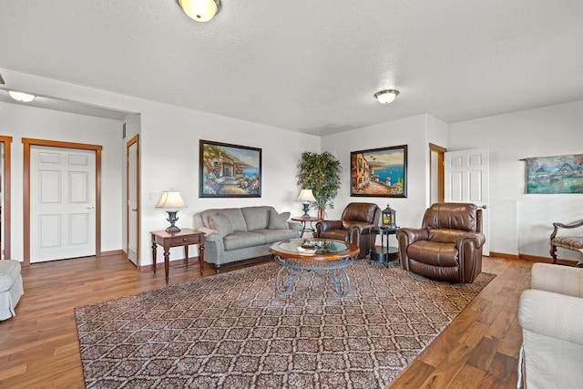 8918 E Clearview Ln, Spokane, WA 99217 - living area featuring wood finished floors and a textured ceiling