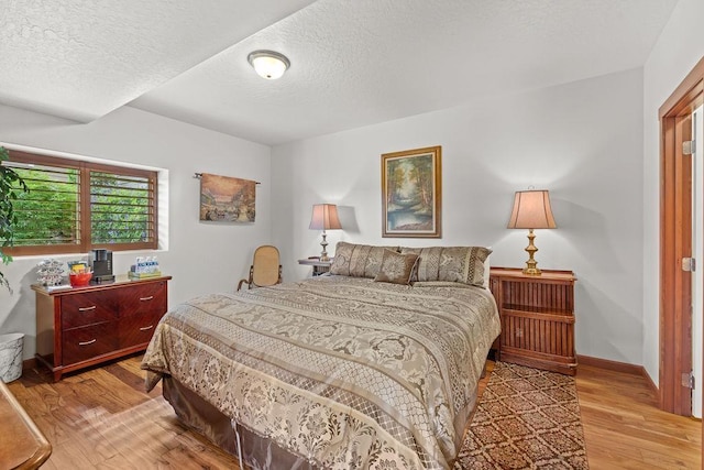 8918 E Clearview Ln, Spokane, WA 99217 - bedroom with light wood-type flooring and a textured ceiling