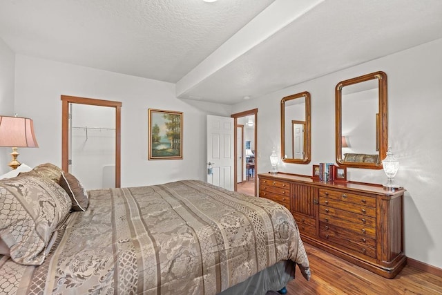 8918 E Clearview Ln, Spokane, WA 99217 - bedroom with wood finished floors and a spacious closet