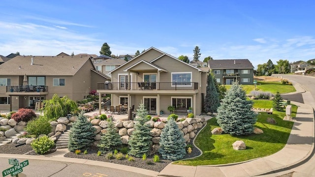 8918 E Clearview Ln, Spokane, WA 99217 - craftsman inspired home with a residential view, a patio, and a balcony