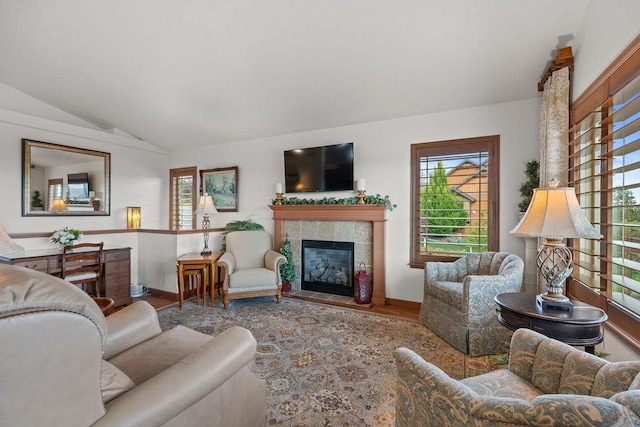 8918 E Clearview Ln, Spokane, WA 99217 - living room with wood finished floors, vaulted ceiling, and a fireplace