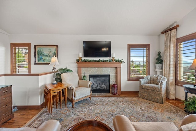 8918 E Clearview Ln, Spokane, WA 99217 - living area featuring lofted ceiling, healthy amount of natural light, wood finished floors, and a fireplace