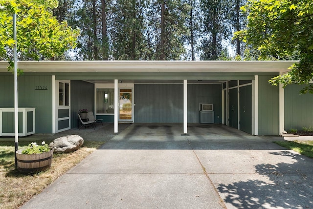 12524 E 20th Ave, Spokane Valley, WA 99216 - view of vehicle parking featuring an attached carport and concrete driveway