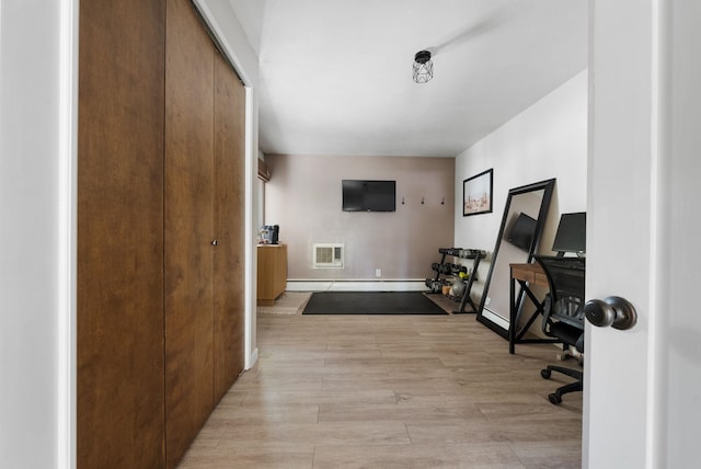 12524 E 20th Ave, Spokane Valley, WA 99216 - office with light wood finished floors and a baseboard heating unit