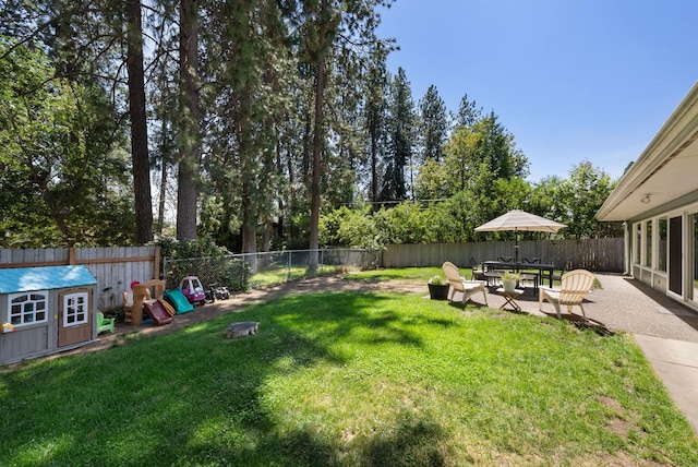 12524 E 20th Ave, Spokane Valley, WA 99216 - fenced backyard with a patio area and a storage shed