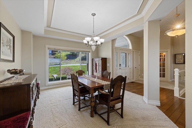 5106 E Glennaire Dr, Spokane, WA 99223 - dining area with a chandelier, hardwood / wood-style floors, a tray ceiling, and ornamental molding