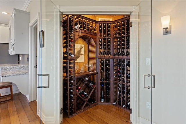 5106 E Glennaire Dr, Spokane, WA 99223 - wine room with light wood-type flooring, crown molding, and recessed lighting