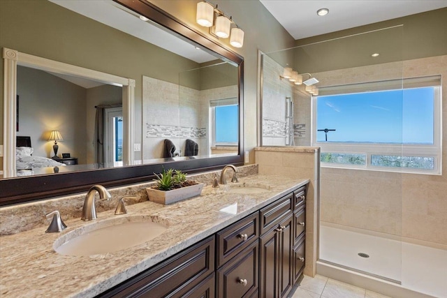 5106 E Glennaire Dr, Spokane, WA 99223 - bathroom featuring ensuite bathroom, double vanity, walk in shower, and tile patterned floors