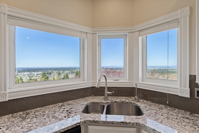 5106 E Glennaire Dr, Spokane, WA 99223 - kitchen with a sink and light stone countertops