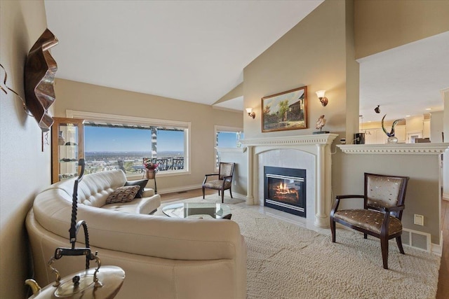5106 E Glennaire Dr, Spokane, WA 99223 - living area featuring a tiled fireplace and high vaulted ceiling