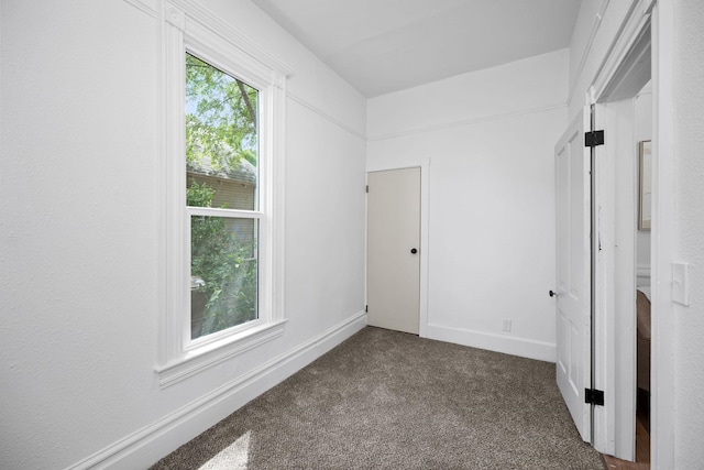2304 E 6th Ave, Spokane, WA 99202 - unfurnished bedroom with dark carpet and baseboards