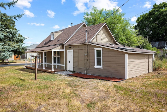2304 E 6th Ave, Spokane, WA 99202 - back of property with a lawn and roof with shingles