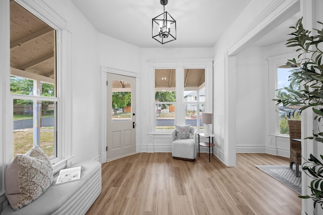 2304 E 6th Ave, Spokane, WA 99202 - sitting room with light wood-type flooring, a chandelier, and beamed ceiling