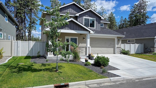 7169 S Parkridge Blvd, Spokane, WA 99224 - craftsman-style home with board and batten siding, driveway, an attached garage, stone siding, and a porch