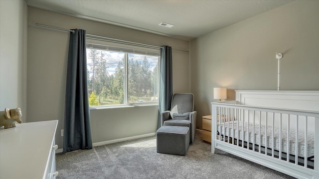 7169 S Parkridge Blvd, Spokane, WA 99224 - bedroom featuring carpet flooring and a crib