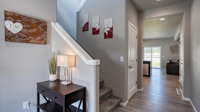 7169 S Parkridge Blvd, Spokane, WA 99224 - stairway with wood finished floors and recessed lighting