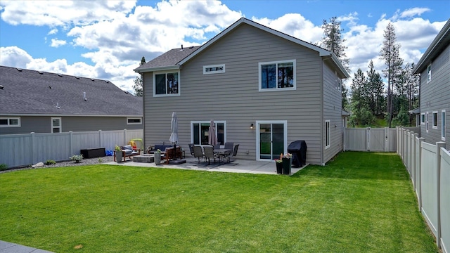 7169 S Parkridge Blvd, Spokane, WA 99224 - rear view of house featuring a patio, a fenced backyard, and an outdoor fire pit