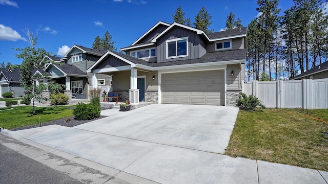 7169 S Parkridge Blvd, Spokane, WA 99224 - craftsman inspired home featuring board and batten siding, concrete driveway, a porch, stone siding, and a garage