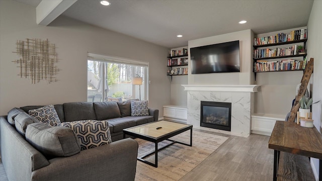 7169 S Parkridge Blvd, Spokane, WA 99224 - living area featuring light wood-style flooring, a fireplace, and recessed lighting