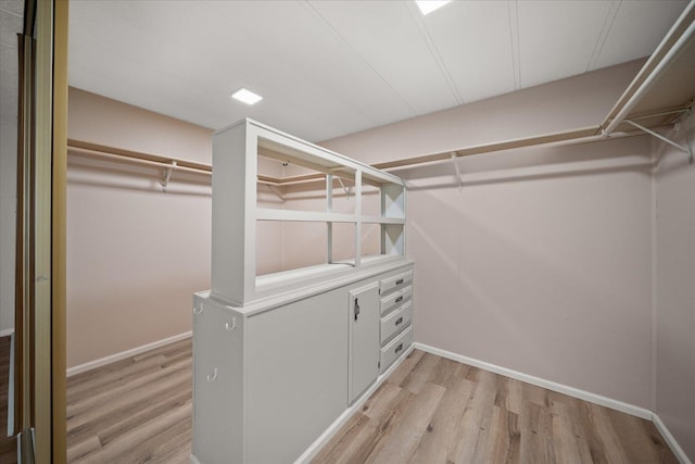 18822 E Montgomery Dr, Otis Orchards, WA 99027 - walk in closet with light wood-type flooring