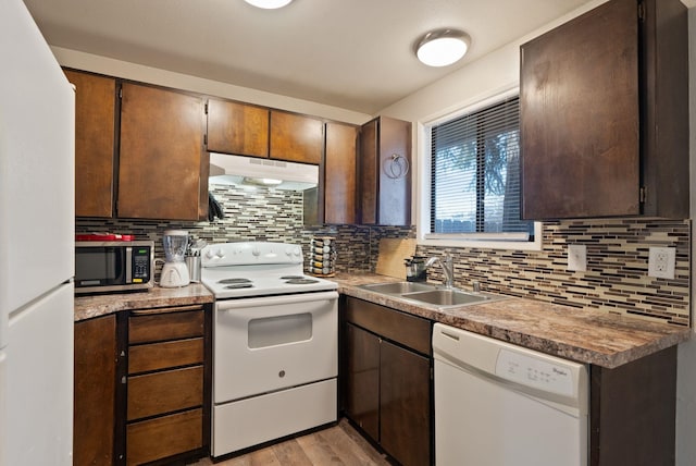 2117 E Euclid Avenue 2119E Euclid Ave, Spokane, WA 99207 - kitchen featuring white appliances, under cabinet range hood, backsplash, light wood-type flooring, and dark brown cabinetry