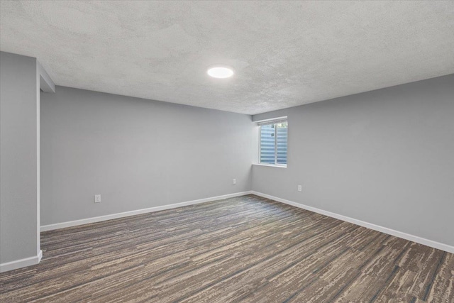 2224 N Lily Rd, Spokane, WA 99212 - empty room with a textured ceiling and dark wood finished floors