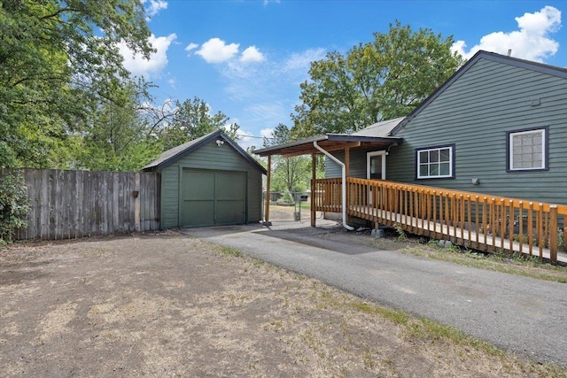 2224 N Lily Rd, Spokane, WA 99212 - view of front facade featuring asphalt driveway, an outbuilding, and a garage