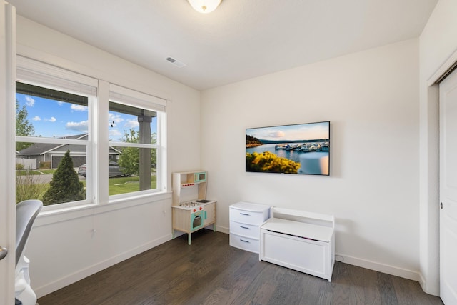 1024 W Staples Rd, Post Falls, ID 83854 - office area featuring dark wood-type flooring and baseboards