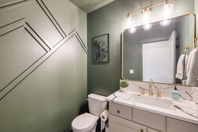 1024 W Staples Rd, Post Falls, ID 83854 - half bathroom featuring toilet and vanity